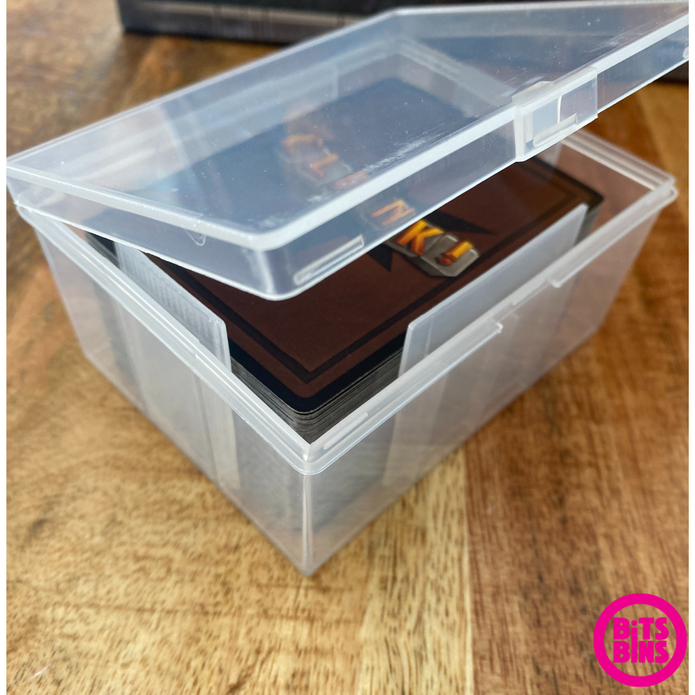 an open deck box showing a deck of clank cards on a wood background