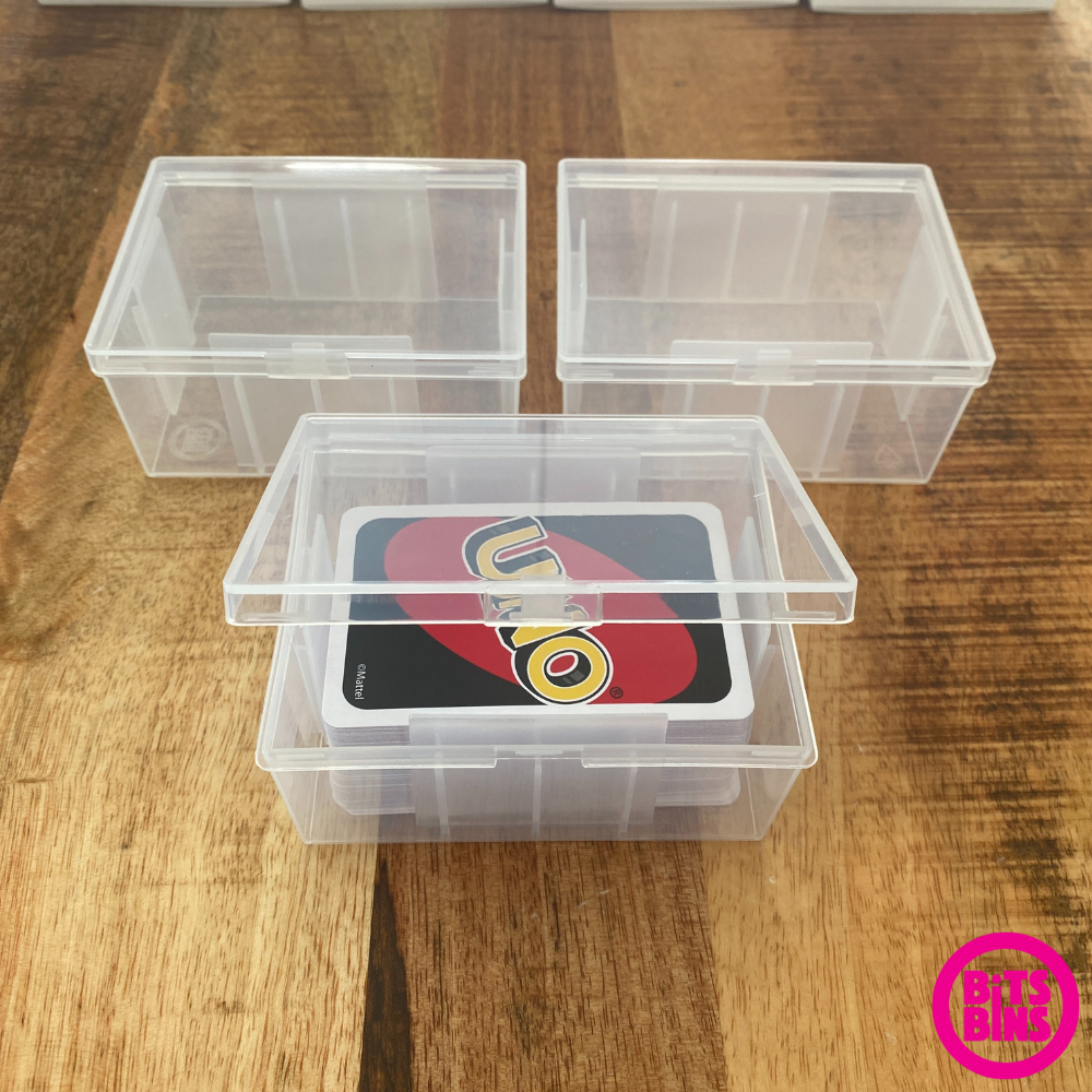 Showing 3 big card boxes holding an uno deck