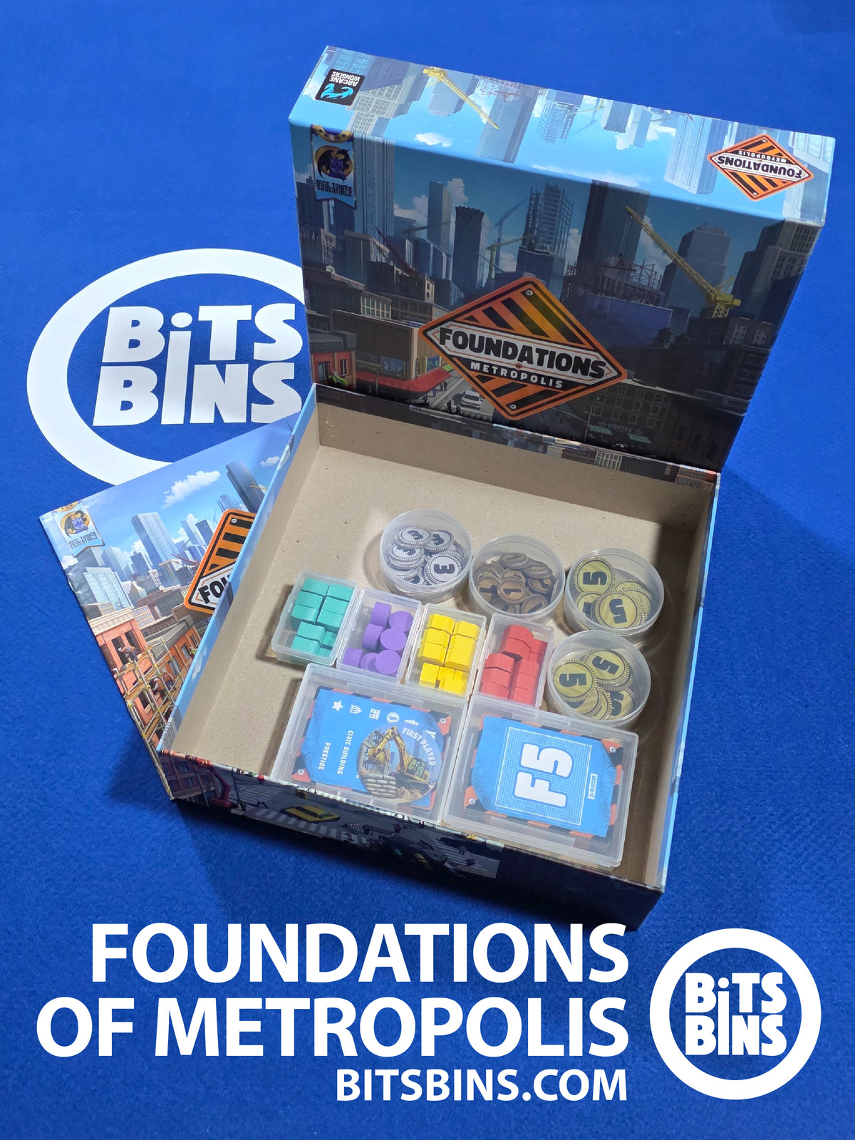 Foundations of Metropolis organizer set by BitsBins laid out: 2 Card Boxes for the deed cards, player aids and first player marker, 4 Minis for the player pieces and 4 Pods for the coins.