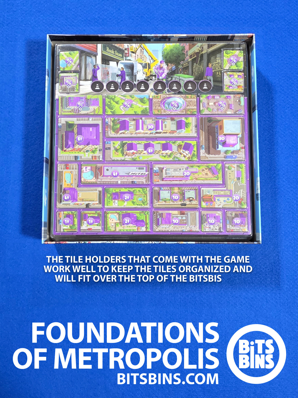 Foundations of Metropolis tile trays from the game sitting on top of the BitsBins inside the original box.