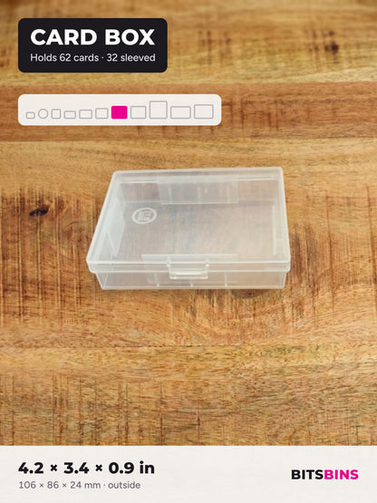 Single BitsBins Card Box on a wood table. Holds a standard deck of 62 cards or 32 sleeved cards. 4.2 x 3.4 x 0.9 in (106 x 86 x 24 mm).