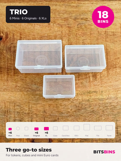 BitsBins Trio on a wood table: one each of the XL, Original and Mini. The Trio pack has 18 bins: 6 Minis, 6 Originals and 6 XLs, shown in the size strip.